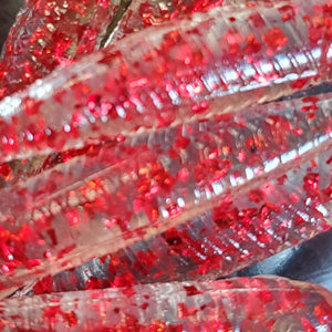 Color Code 0002 - Clear plastic with assorted sized and shape red glitter