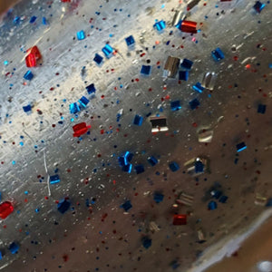 Color Code 0009 -  Clear Plastice with Balanced Assorted Size and Shaped Silver, Blue, and Red Glitter