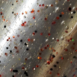Color Code 0004 - Clear plastic with Small and Fine Red Glitter,  Small and Fine orange glitter, Small and Fine Black Glitter,  and Fine Holographic Gold Glitter
