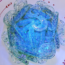 Load image into Gallery viewer, Color Code 0031 Clear Plastic with UV, Fine Emerald Glitter, Fine Green Glitter, Black Glitter, and Gold Glitter (Under UV Light)