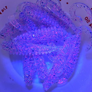 Color Code 0017: Clear Plastic with Pink Glitter, Silver Glitter, and Blue Glitter with UV (Jumping Jack under  UV light)