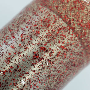 Color Code 0040:  Clear Plastic with small and fine red glitter