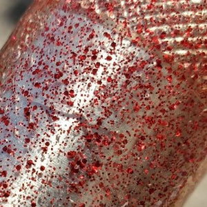 Color Code 0040:  Clear Plastic with small and fine red glitter in full sunlight