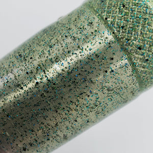 Color Code 0031 Clear Plastic with Fine Emerald Glitter, Fine Green Glitter, Black Glitter, and Gold Glitter (Inside light)