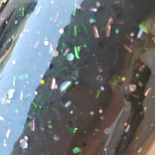 Load image into Gallery viewer, Color Code 0024  Black Oil Slick = Black plastic with a green oil slick, assorted sized and shaped black glitter, holographic gold glitter, and copper glitter
