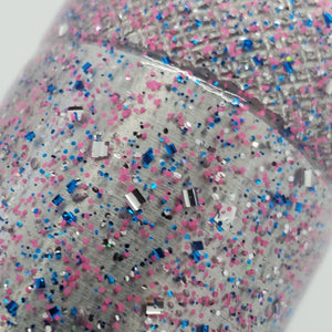 Color Code 0038: Clear plastic with pink glitter, blue glitter, silver glitter, holographic glitter