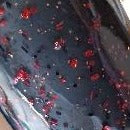 Color Code 0014 : Unko Billy's Black  - Black Plastic with Assorted Sized Red, Orange, and Black Glitter